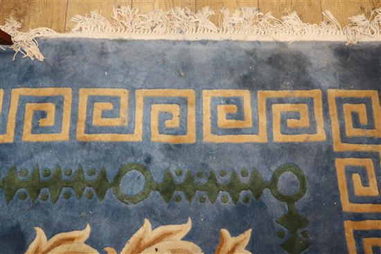 A Chinese blue ground carpet with Greek key border 480 x 365cm